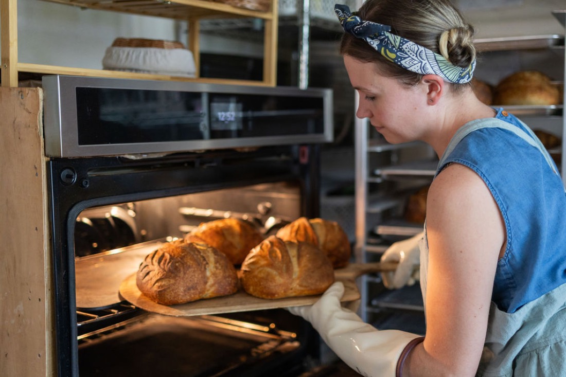 Pulling golden loaves from the oven